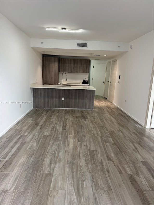 801 S Miami Ave Unit 1808, Miami, FL 33130 - unfurnished living room featuring a sink and dark wood-style floors