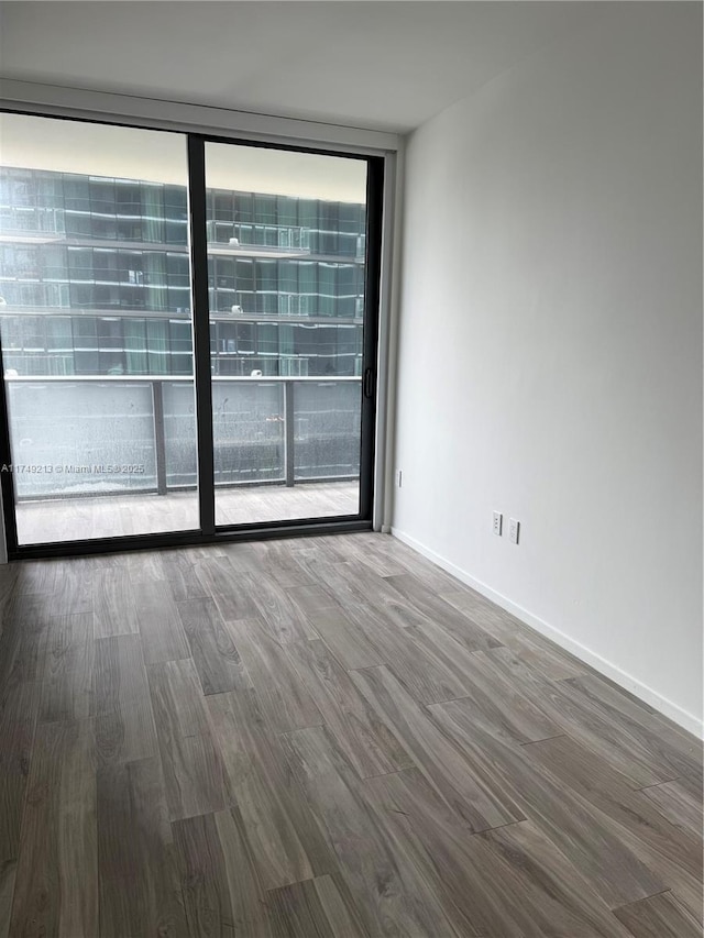 801 S Miami Ave Unit 1808, Miami, FL 33130 - empty room with floor to ceiling windows and wood finished floors
