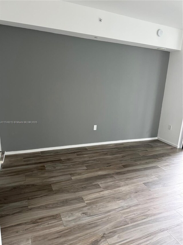 801 S Miami Ave Unit 1808, Miami, FL 33130 - unfurnished room featuring wood finished floors and baseboards