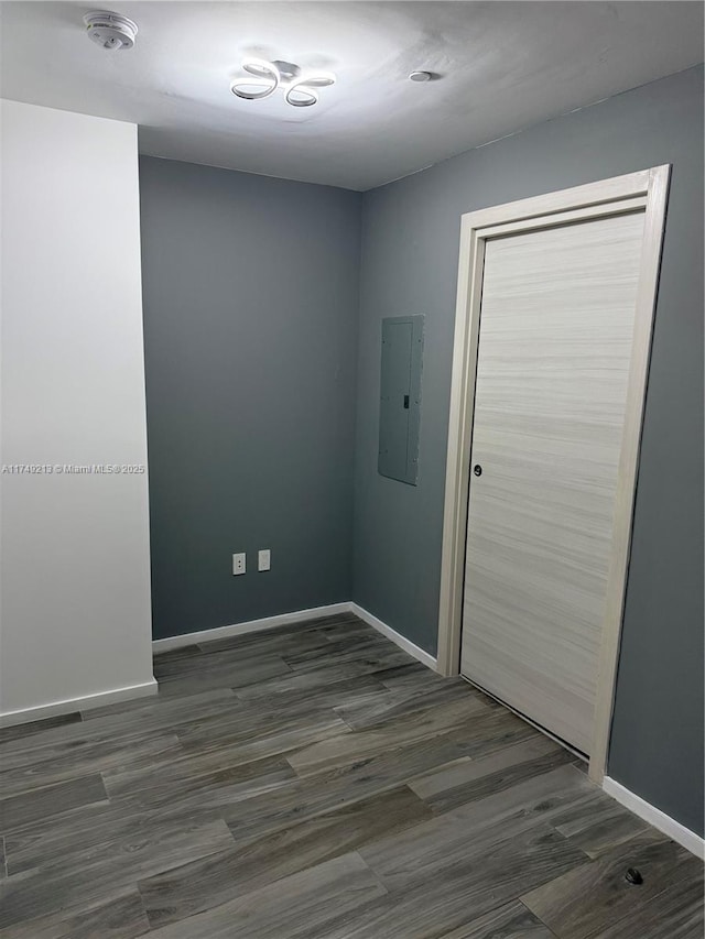 801 S Miami Ave Unit 1808, Miami, FL 33130 - unfurnished room with electric panel, a smoke detector, and dark wood finished floors