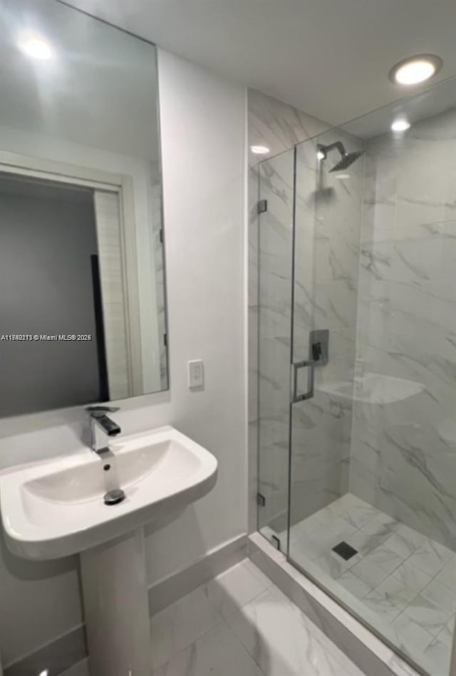 801 S Miami Ave Unit 1808, Miami, FL 33130 - full bath featuring a marble finish shower, marble look tile flooring, and recessed lighting