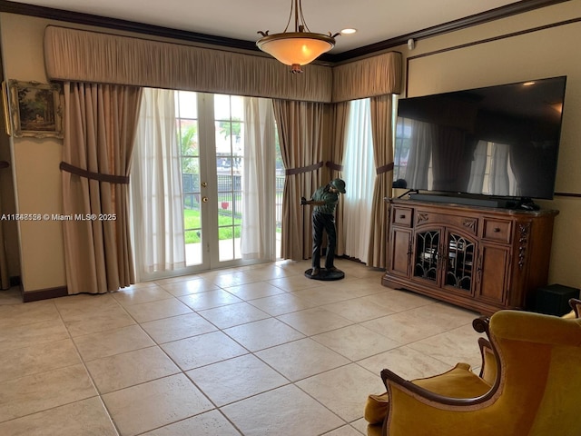 living room featuring a wealth of natural light, light tile patterned floors, and french doors