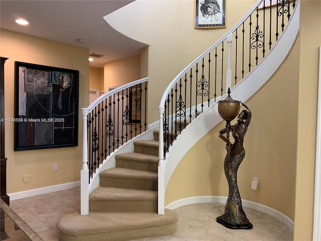 stairway featuring visible vents, recessed lighting, and baseboards