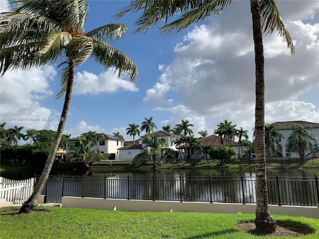 view of water feature with fence