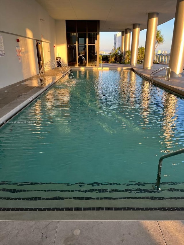 pool with a patio area