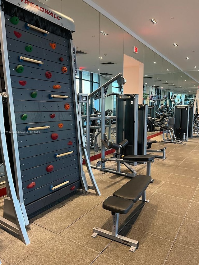 gym featuring a wall of windows