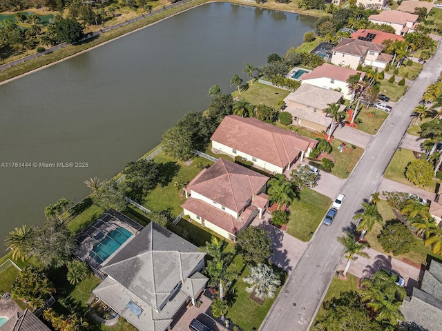 aerial view with a water view and a residential view