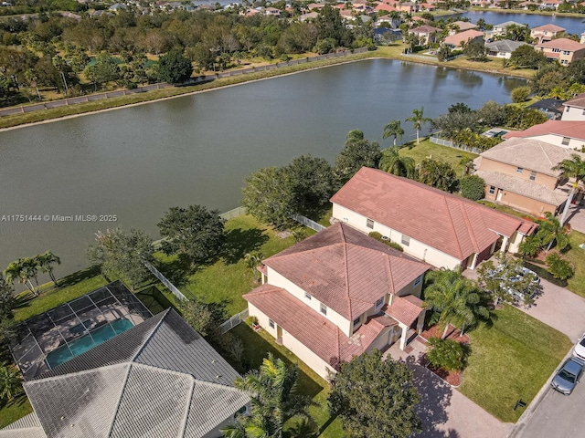 bird's eye view with a residential view and a water view