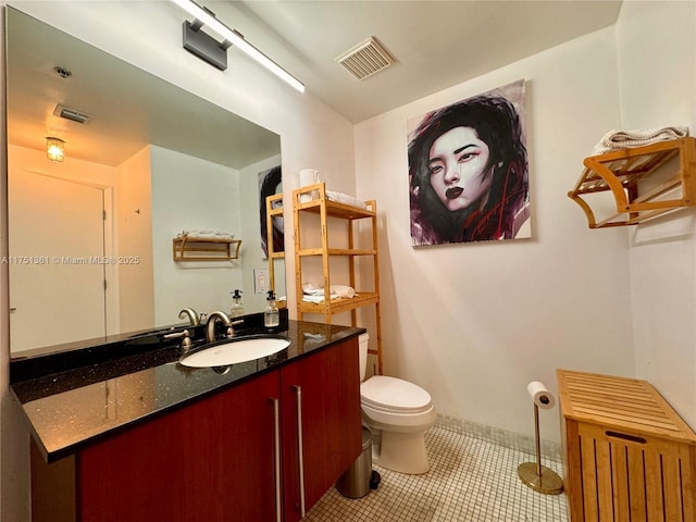 bathroom featuring toilet, tile patterned floors, vanity, visible vents, and radiator