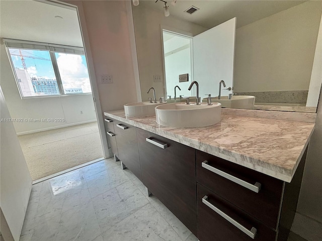 full bathroom with visible vents, marble finish floor, and a sink