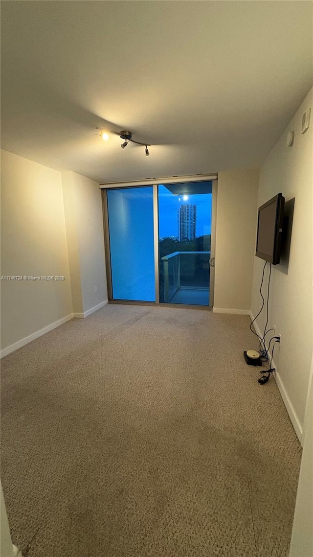 1600 SW 1st Ave Unit 703, Miami, FL 33129 - carpeted empty room featuring baseboards