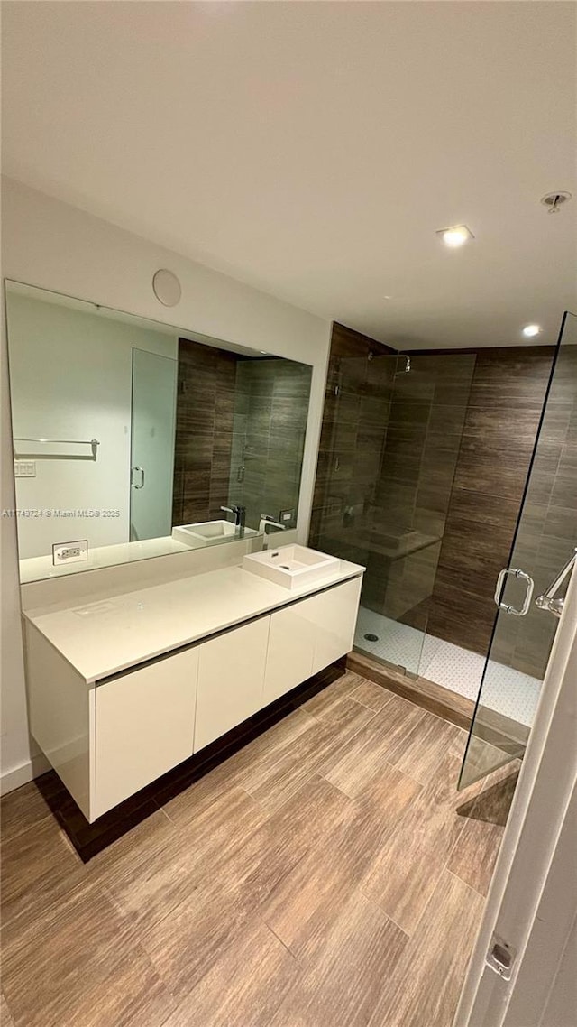 1600 SW 1st Ave Unit 703, Miami, FL 33129 - full bath with double vanity, a stall shower, and recessed lighting