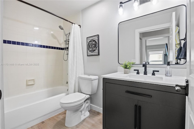 full bathroom with toilet, shower / bath combination with curtain, wood finished floors, and vanity