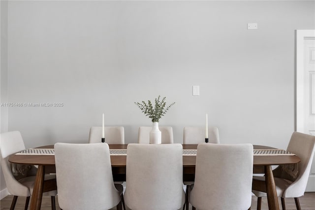 dining area with wood finished floors