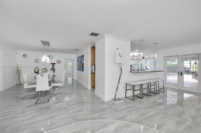 dining area with ornamental molding, french doors, visible vents, and baseboards