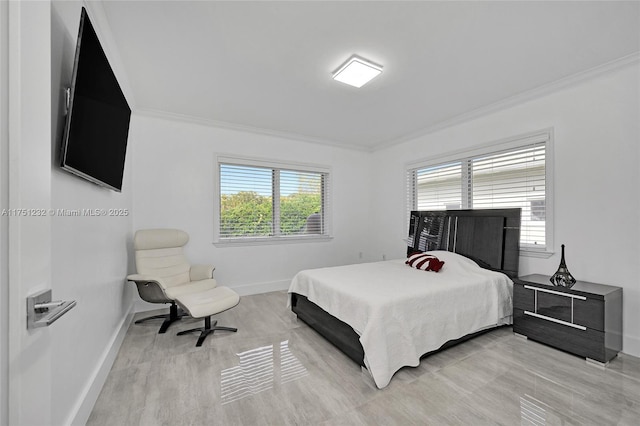 bedroom with crown molding and baseboards