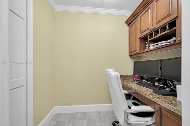 home office featuring ornamental molding and baseboards