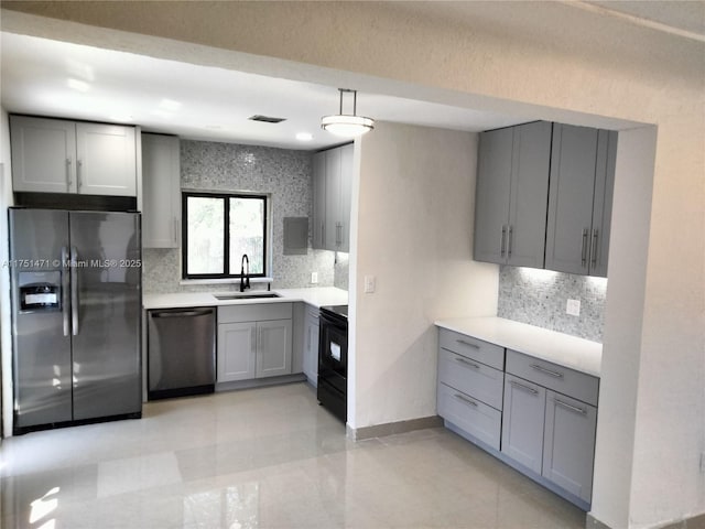 kitchen with dishwasher, black range with electric stovetop, gray cabinetry, refrigerator with ice dispenser, and a sink