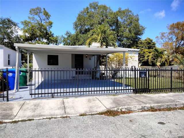 view of front of house featuring a fenced front yard and stucco siding