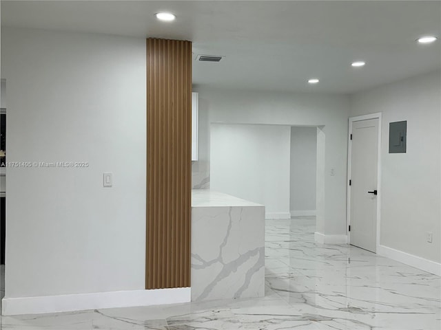 corridor featuring marble finish floor, electric panel, visible vents, and recessed lighting