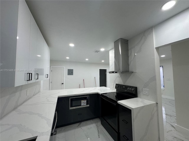 kitchen with extractor fan, a peninsula, marble finish floor, black appliances, and modern cabinets