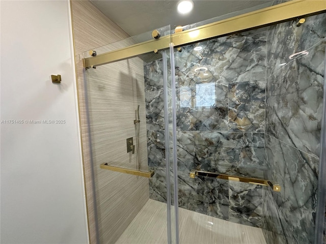 bathroom featuring a shower stall