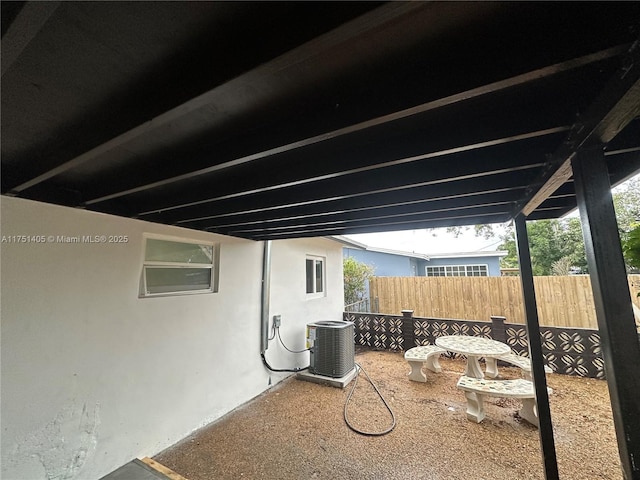 view of patio with fence and central air condition unit