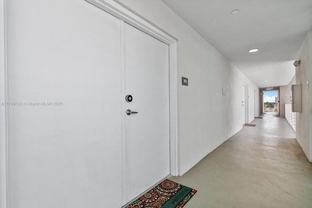 corridor featuring concrete flooring