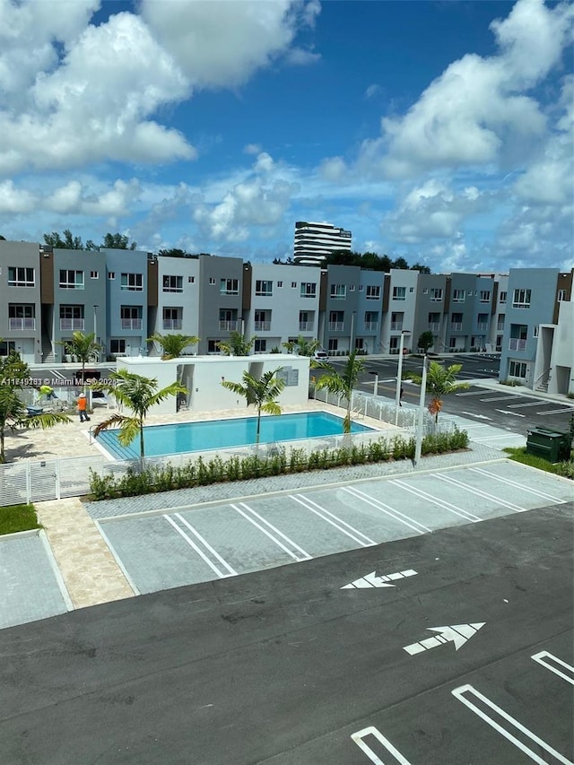 exterior space featuring fence and a swimming pool