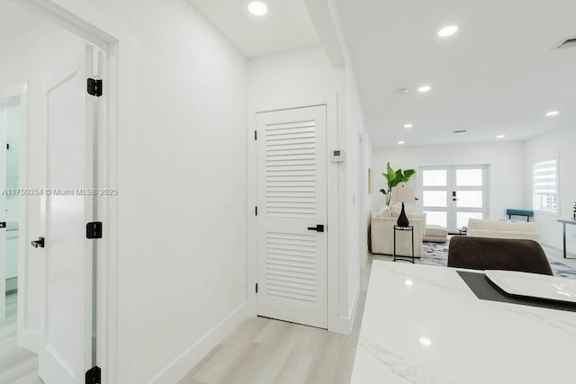 office featuring baseboards, french doors, light wood-style floors, and recessed lighting