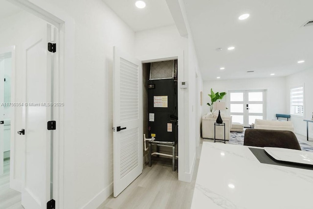 office area featuring baseboards, light wood-type flooring, and recessed lighting