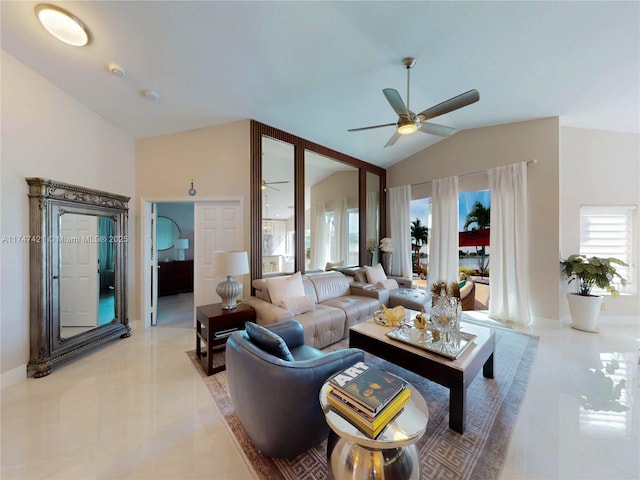 living room featuring a healthy amount of sunlight, light tile patterned floors, a ceiling fan, and lofted ceiling