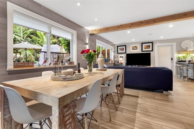 dining area with beamed ceiling, recessed lighting, and wood tiled floor