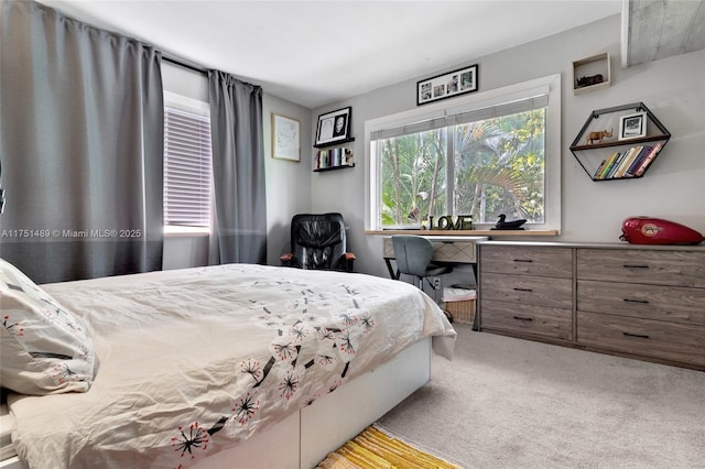 bedroom with light colored carpet