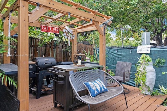 deck featuring outdoor dining area and fence