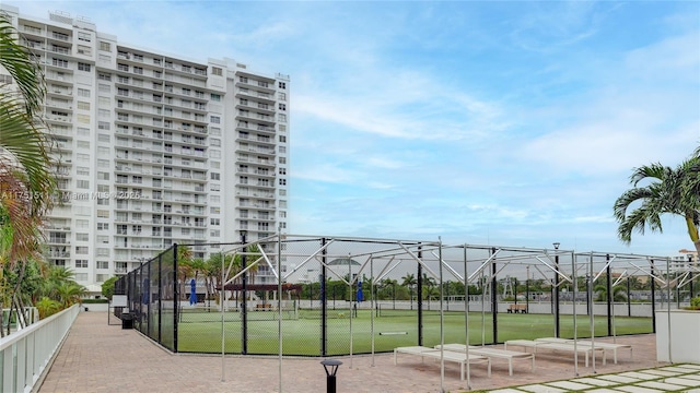 view of community featuring fence