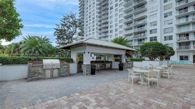 view of patio / terrace with a gazebo, grilling area, and an outdoor kitchen