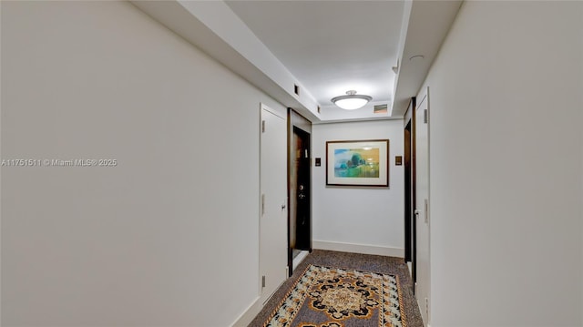 hallway featuring baseboards