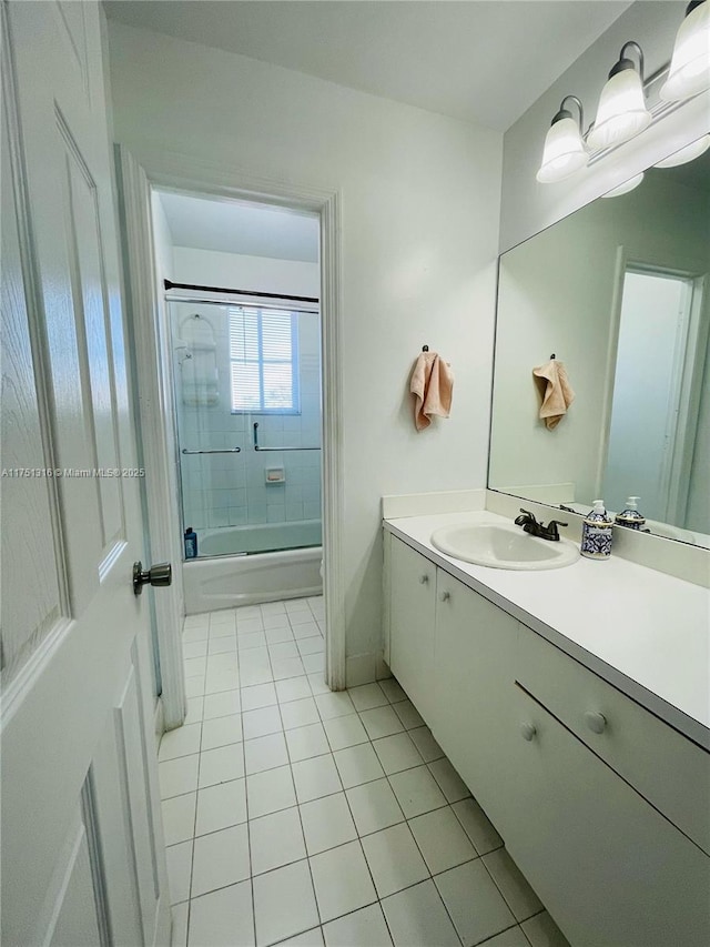 full bathroom featuring tile patterned floors, shower / bath combination with glass door, and vanity