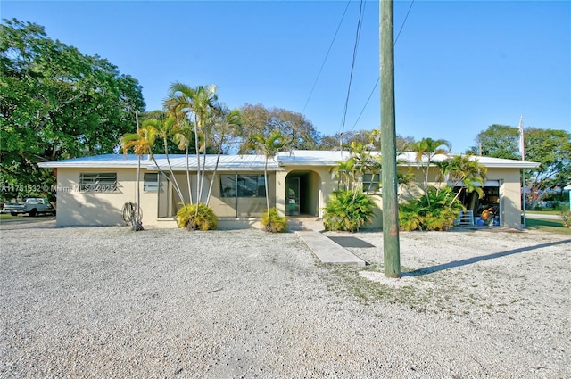 single story home with stucco siding