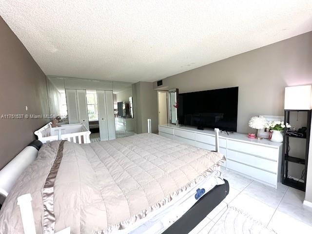 bedroom featuring a textured ceiling