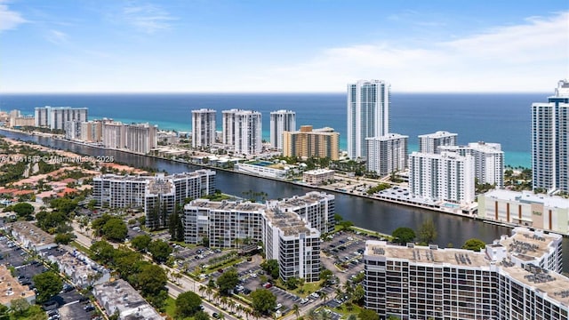 bird's eye view featuring a water view and a view of city