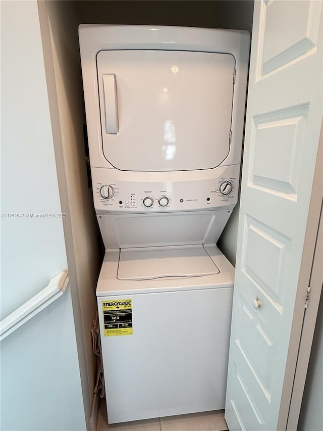 4640 NW 84th Ave Unit 13, Doral, FL 33166 - washroom featuring estacked washer and dryer
