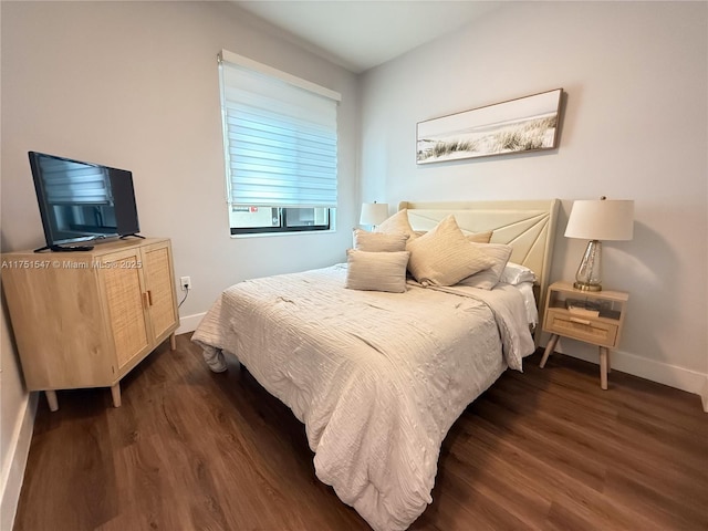 4640 NW 84th Ave Unit 13, Doral, FL 33166 - bedroom with dark wood finished floors and baseboards