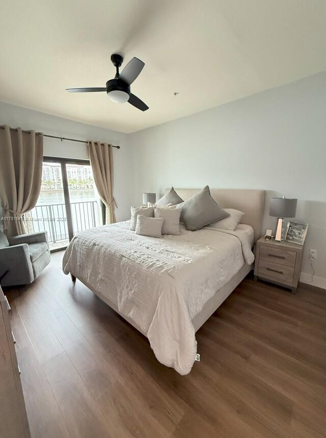 4640 NW 84th Ave Unit 13, Doral, FL 33166 - bedroom with access to exterior, wood finished floors, a ceiling fan, and baseboards
