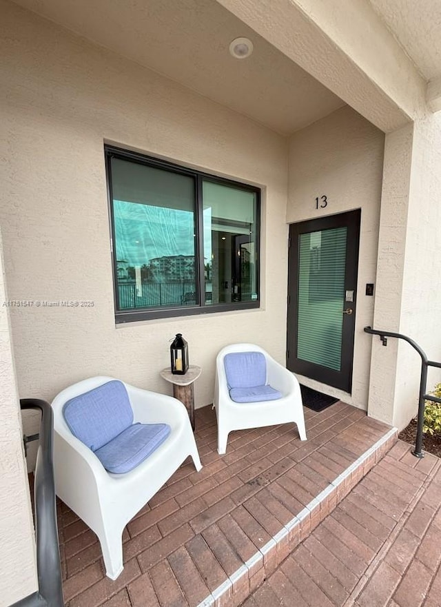 4640 NW 84th Ave Unit 13, Doral, FL 33166 - doorway to property featuring stucco siding