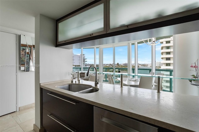 kitchen with a city view, light countertops, and a sink