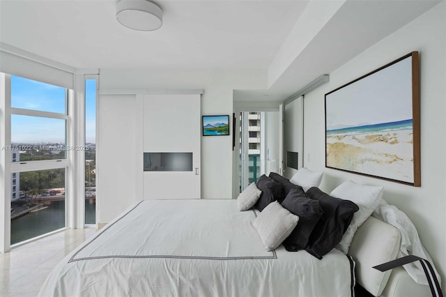 bedroom featuring light tile patterned floors