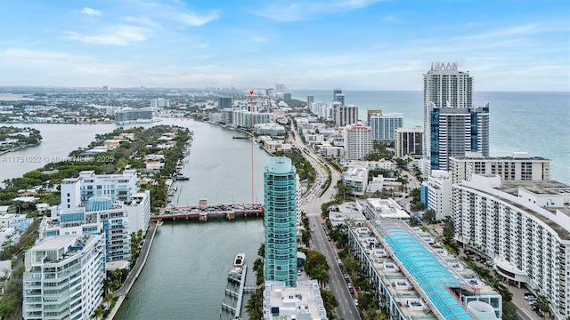 aerial view featuring a water view and a view of city