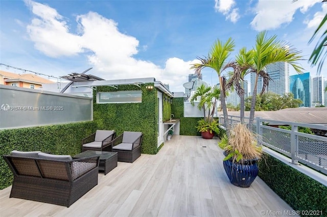 view of patio with a view of city and an outdoor hangout area